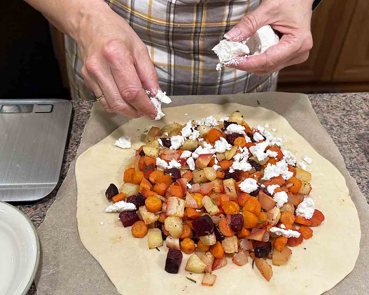 Put veggies on pie crust