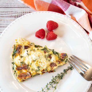 With sun-dried tomatoes, thyme and tangy goat cheese this Sun-Dried Tomato and Spinach Quiche is a perfect entrée from breakfast to supper.