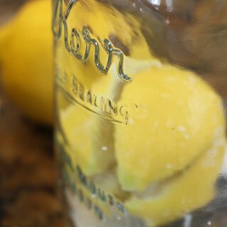 Filling jar with lemons and salt