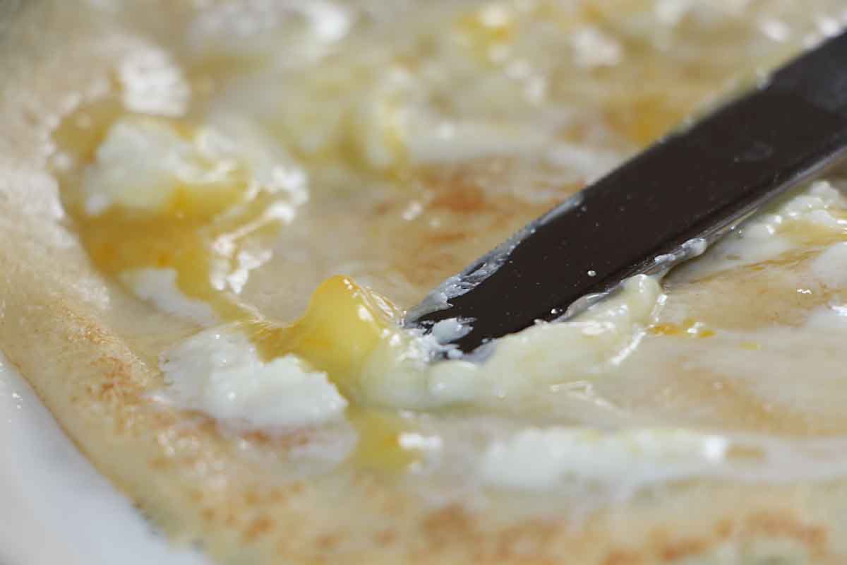 spread crepe with lemon curd and mascaarrpone