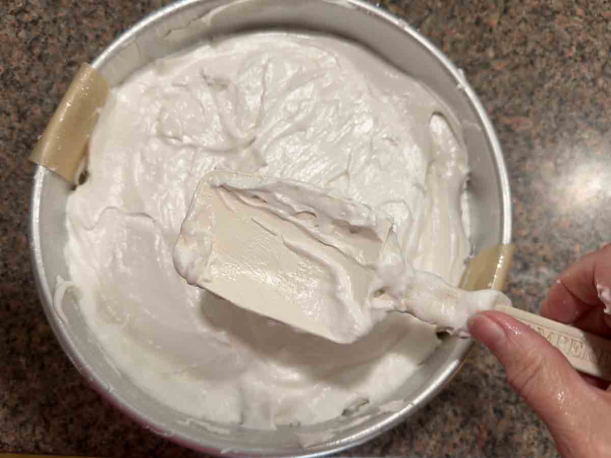 spread meringue in cake pan