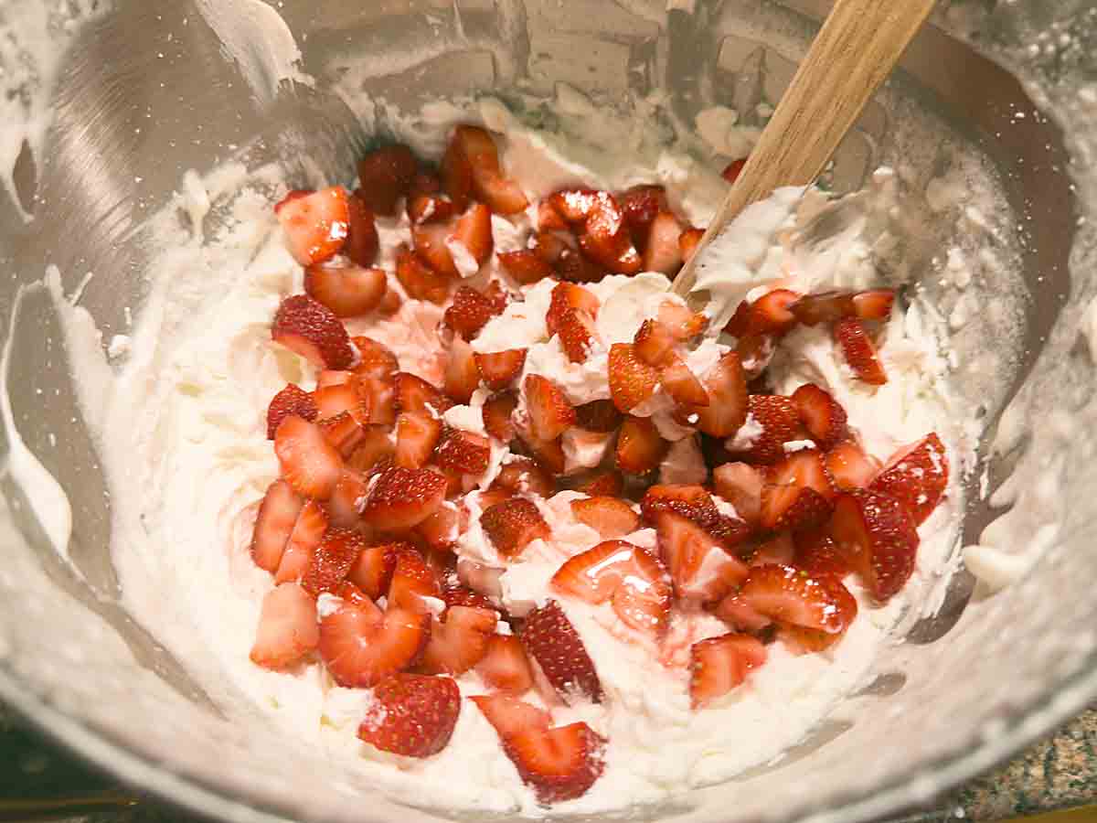 fold berries into whipped cream