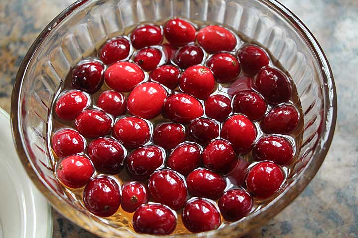 Soak cranberries in simple syrup