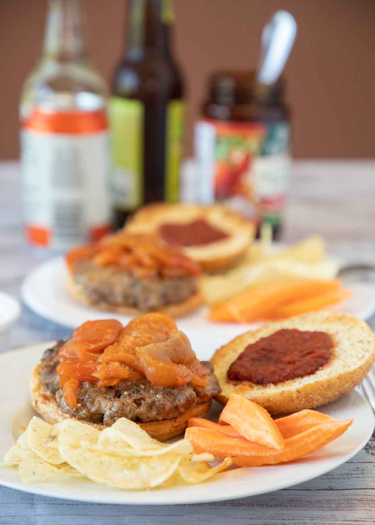 Italian Sausage Sandwiches are delicious topped with pizza sauce and peppers. And super easy whether you go with commercial sausages or homemade.