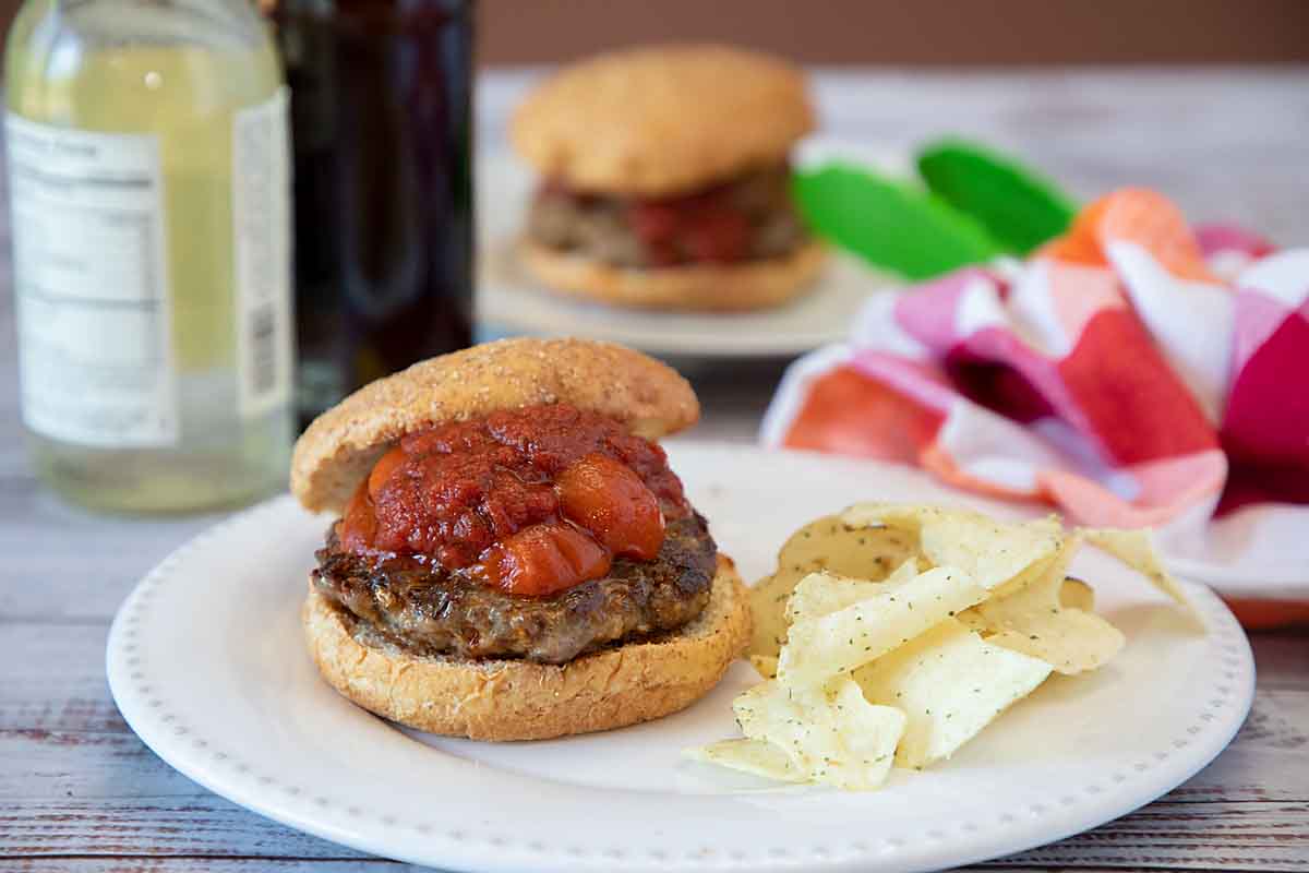 Italian Sausage Sandwiches are delicious topped with pizza sauce and peppers. And super easy whether you go with commercial sausages or homemade.