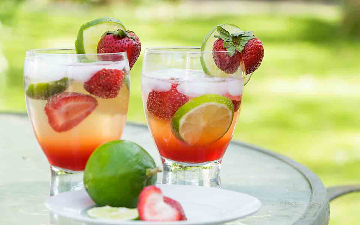 served with strawberry and lime slices