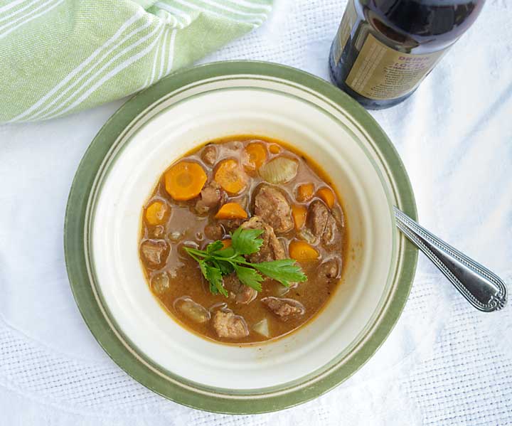 A healthier version of the traditional stew, with added vegetables, Guinness Lamb Stew is rich, meaty, and reminiscent of a the “old county.”
