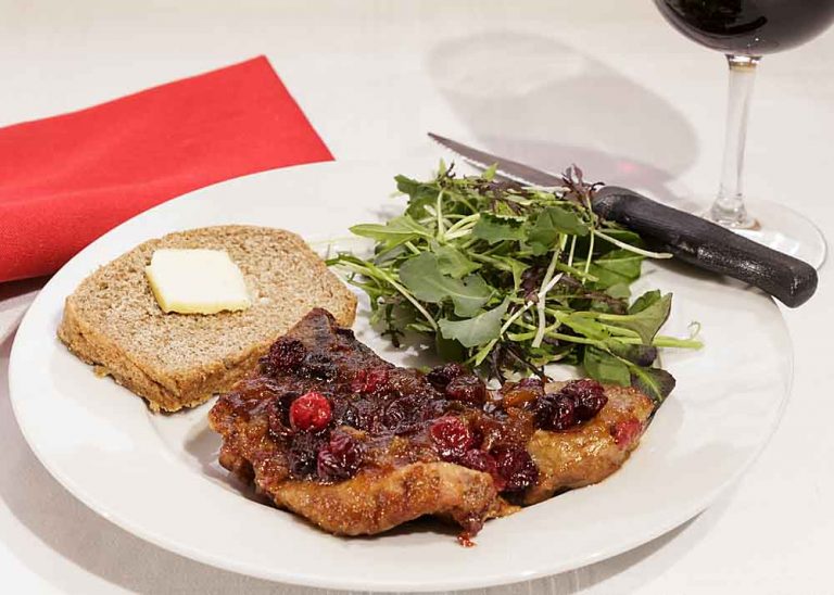 Cranberry Glazed Pork Chops are elegant and "comfy" at the same time. The savory pork and glistening berries make it a perfect dish for Valentine's Day or Christmas dinner.