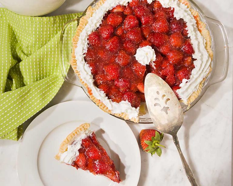 Fresh Strawberry Pie brings together the goodness of berries and the fun of pie. Ripe strawberry halves are placed in a crust then held together with thickened berry juice and topped with whipped cream. It’s a perfect summer treat!