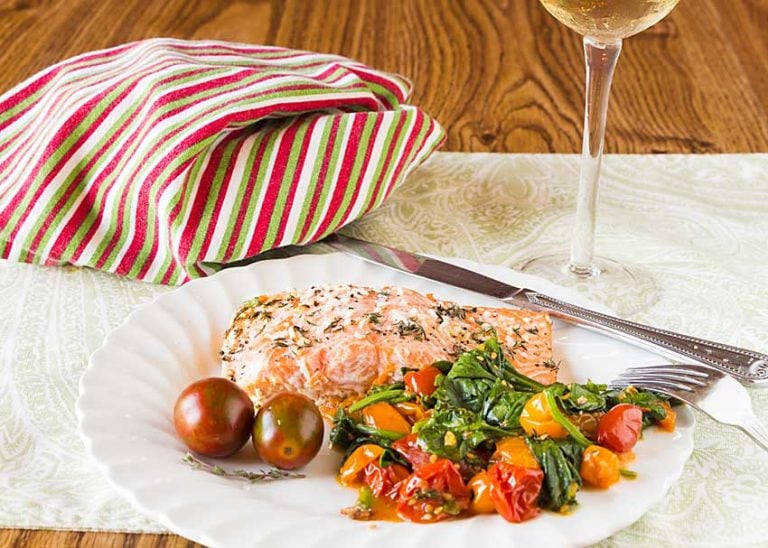 Easy to make, in a single pan, Sheet Pan Salmon with Roasted Tomatoes and Spinach serves up the best of fall. Just add bread for a complete meal.