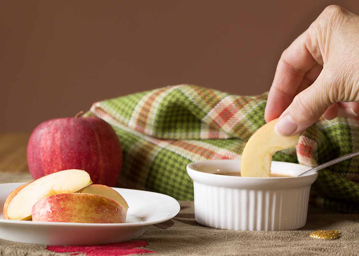 dipping an apple slice 
