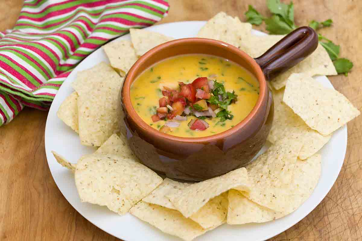 queso dip served with chips