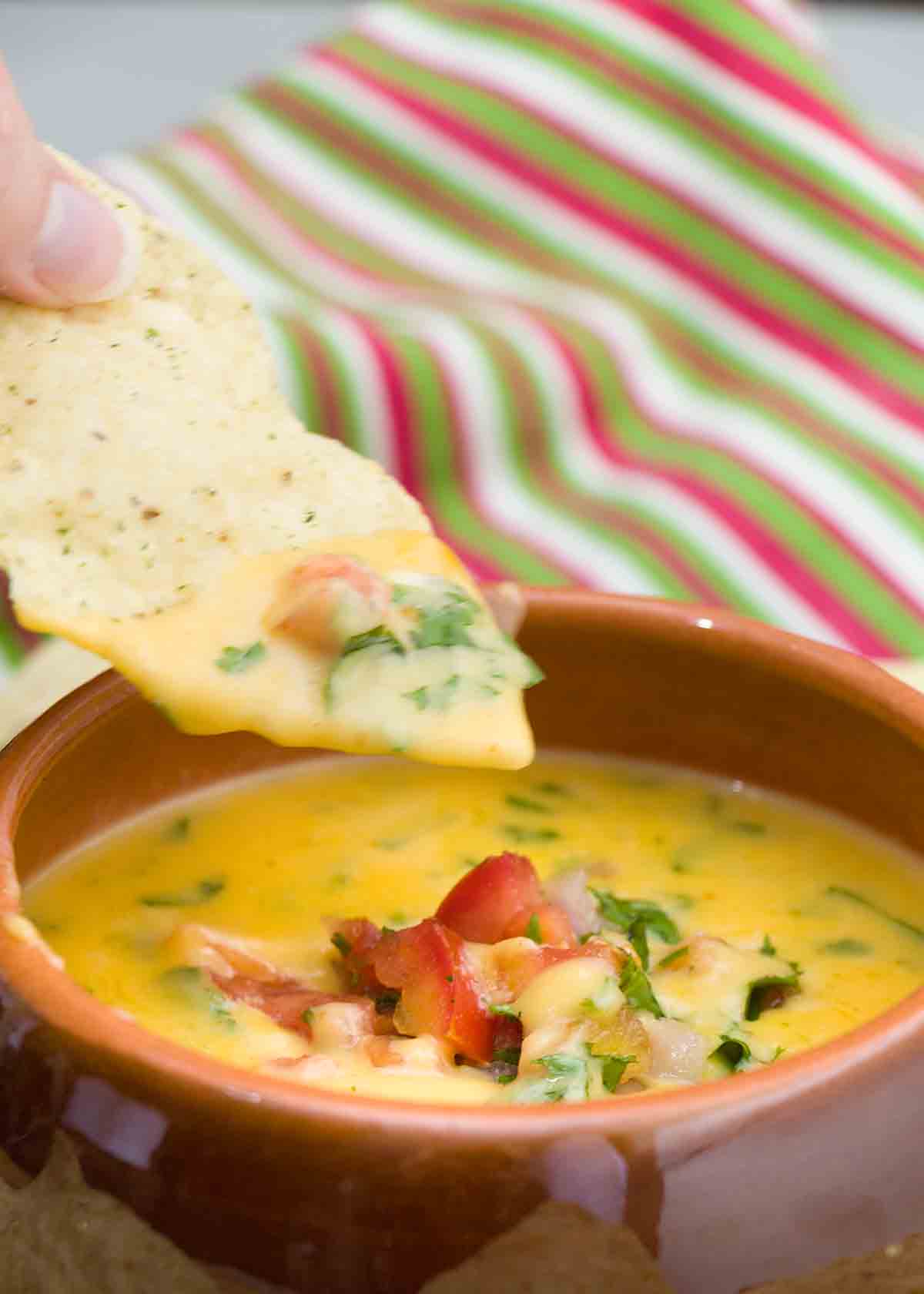 dipping into queso dip