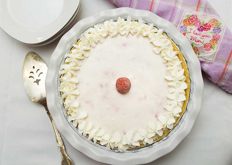 This No-Bake Strawberry Yogurt Pie blends Greek Yogurt, fresh or frozen berries & maple syrup for a pie that's healthier than many on the internet.  Shhhh!