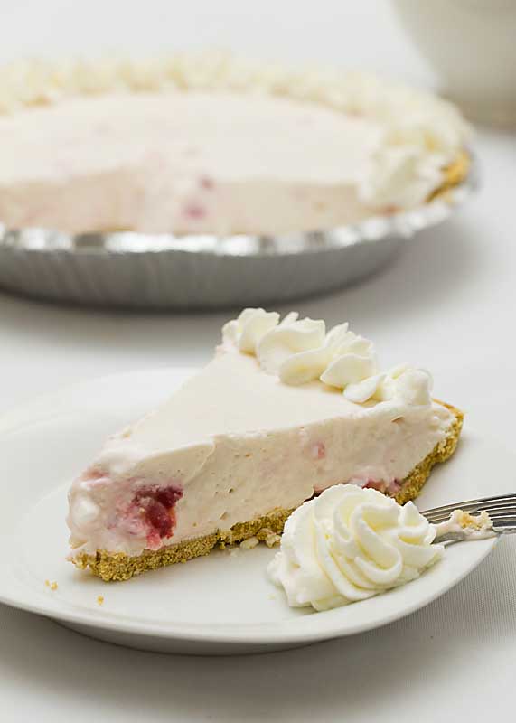 This No-Bake Strawberry Yogurt Pie blends Greek Yogurt, fresh or frozen berries & maple syrup for a pie that's healthier than many on the internet.  Shhhh!
