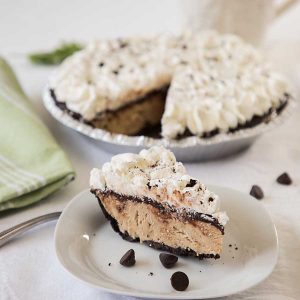 Coffee Fudge Ice Cream Pie, with its cookie crust, velvety ice cream, fudge layer and whipped topping is like a perfect sundae in pie form.