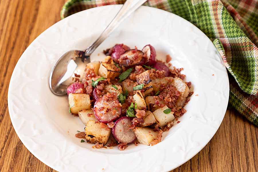 Caramelized and mellow, with a hint of smokey bacon, Pan Roasted Kohlrabi and Radishes is quick, easy, and won't heat up the kitchen!