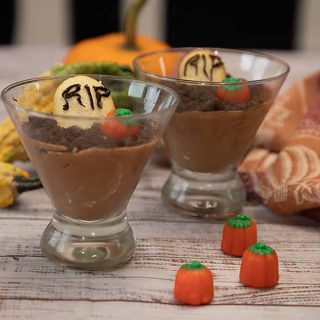 Graveyard Chocolate Mousse is creamy chocolate mousse dressed up for Halloween complete with cookie gravestones. 