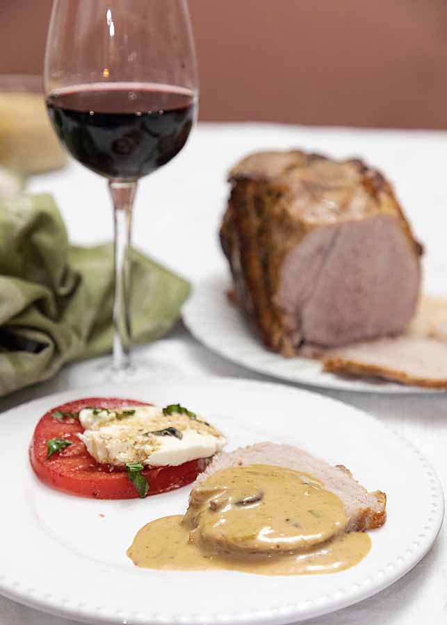 Pork Loin with Mushroom Sauce combines flavorful meat & a rich sauce. It's like an old-fashioned "Sunday dinner" entree with high end flavor.  