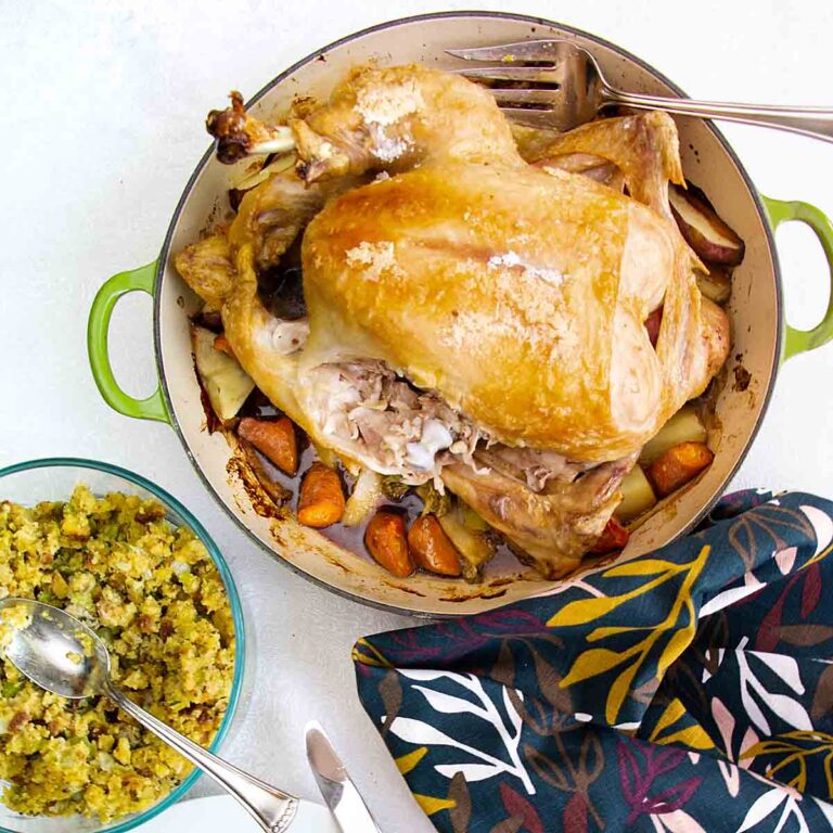 With crispy roast chicken atop golden vegetables, Dutch Oven Whole Chicken is a one pan meal that’s easy, tasty and healthy!