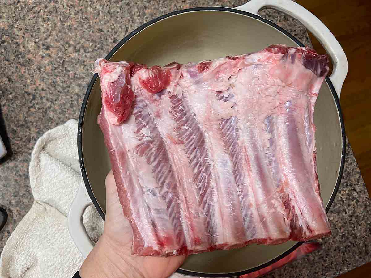Cut ribs to fit cooker