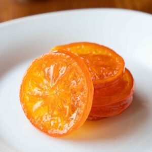 These soft and chewy Candied Orange Slices are perfect for garnishing your favorite desserts and drinks. Or cover them in chocolate for a fun treat!