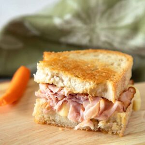 With savory ham, creamy cheese and a punch of mustard, a Grilled Ham and Cheese Saandwich is classic comfort food for a family friendly lunch. 