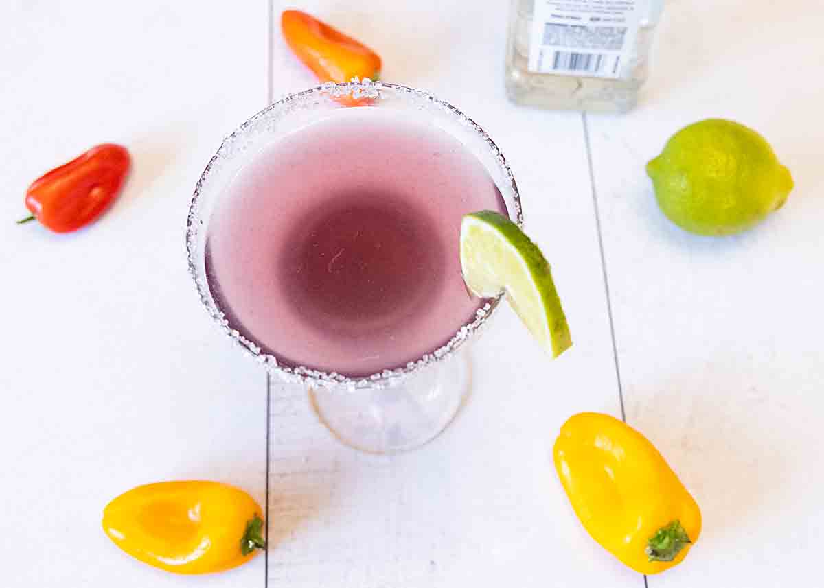 Purple Margarita with lime and peppers