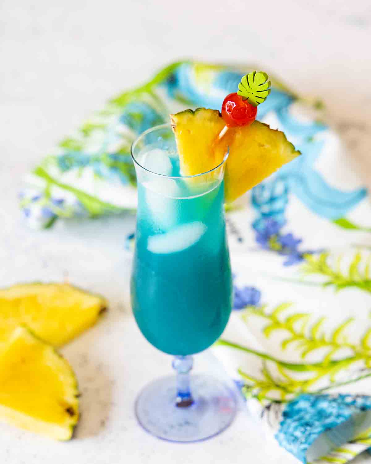 Garnish with pineapple and cherry