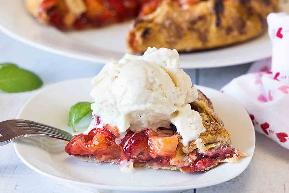 Strawberry Rhubarb Galette slice with ice cream