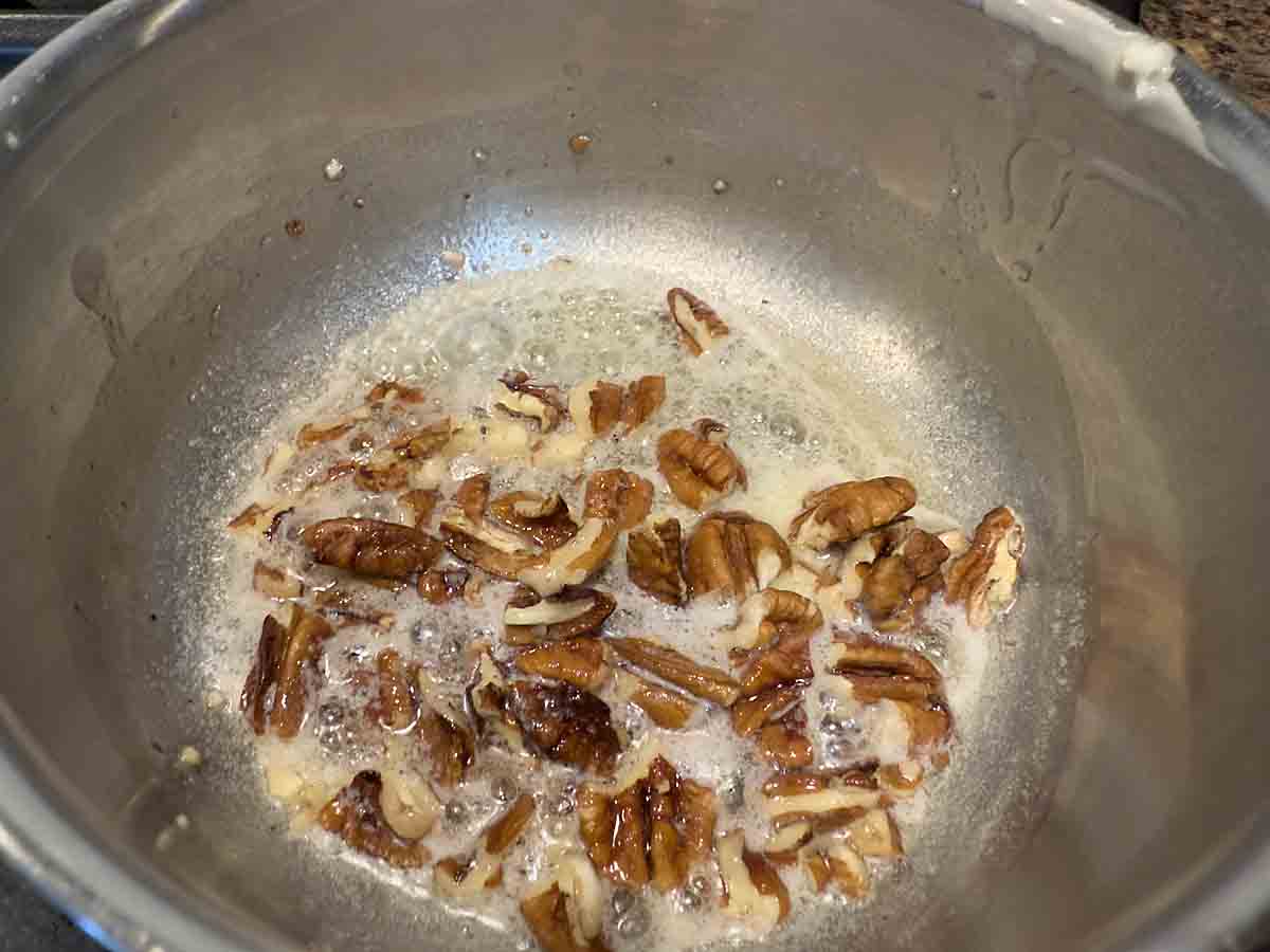 brown pecans in butter