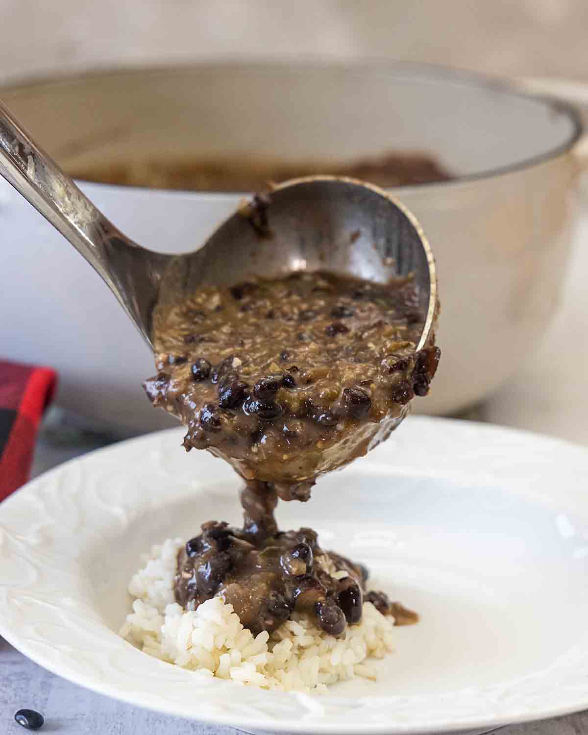 ladeling soup over rice