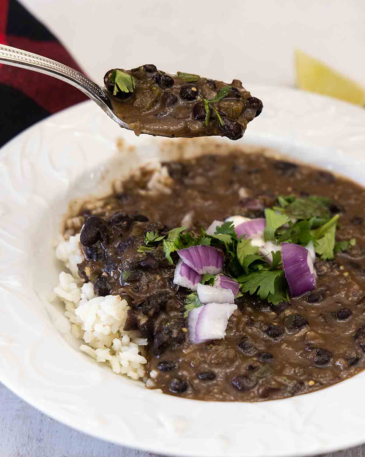 taking a bite pf black bean soup