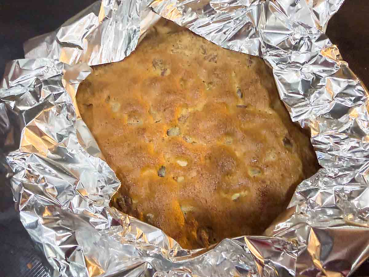 pie with aluminum foil shielding crust