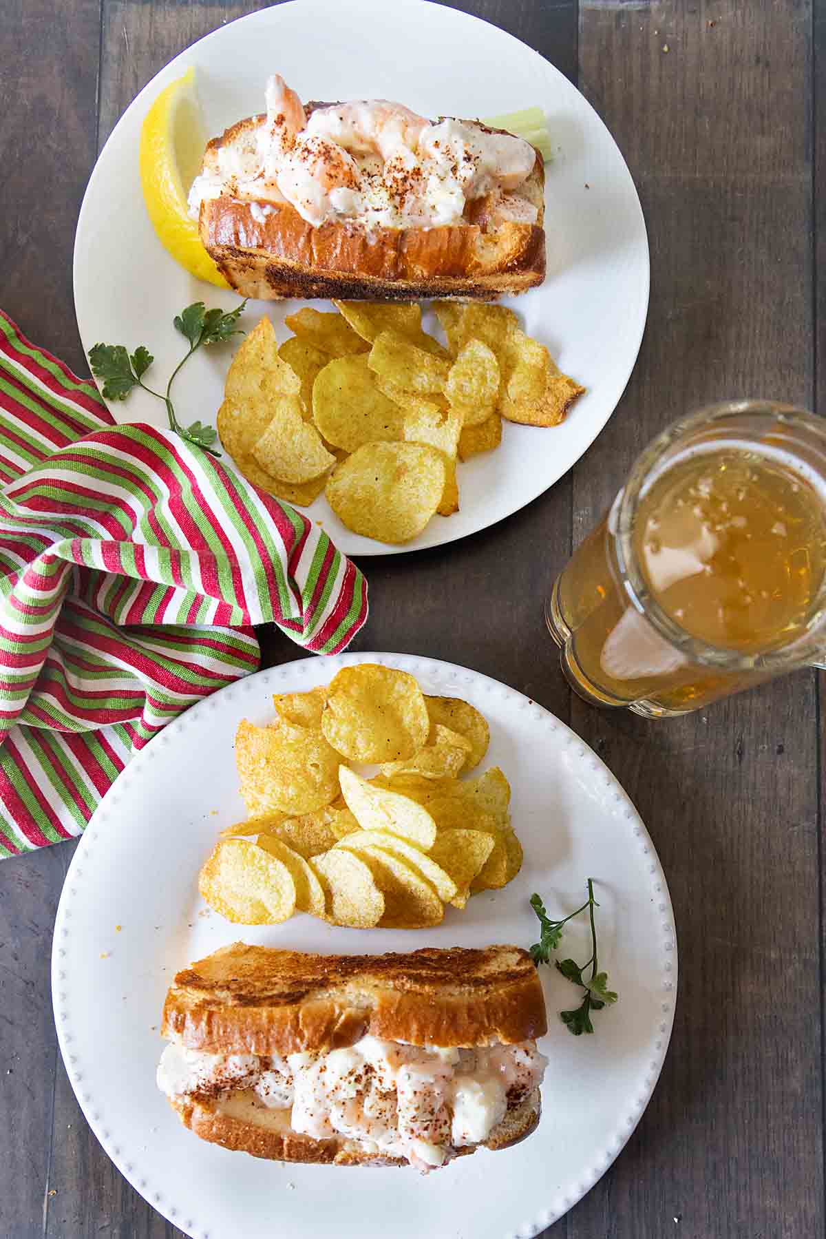 Two plates with shrimp rolls and chips